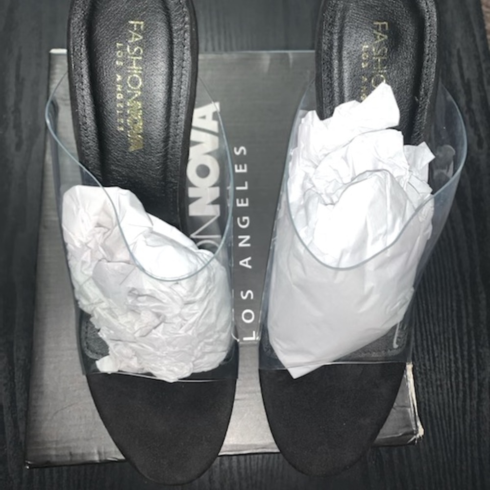 Fashion Nova black and transparent open toe wedge heel.